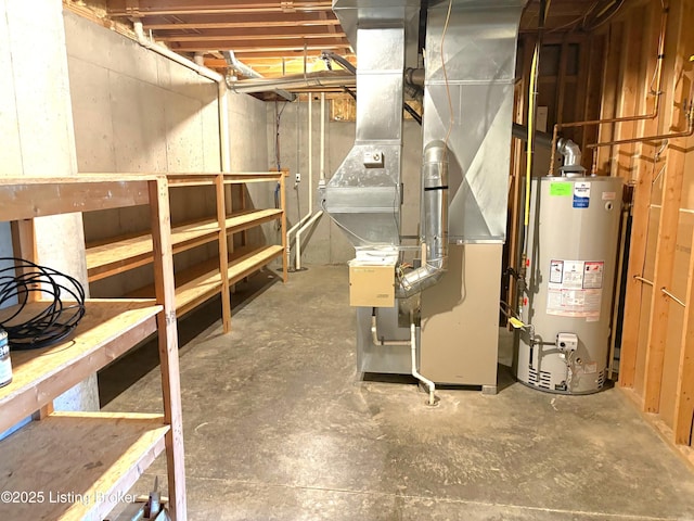 unfinished below grade area featuring heating unit and water heater