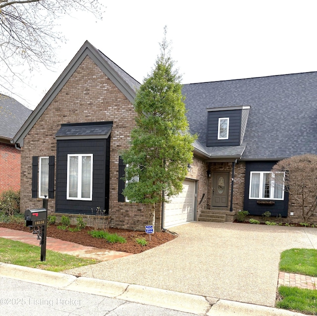 view of front of house with a shingled roof, driveway, brick siding, and a garage