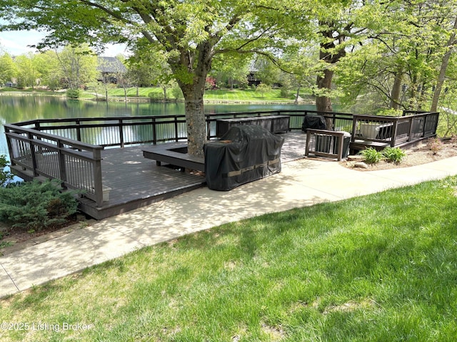 view of patio featuring a deck with water view