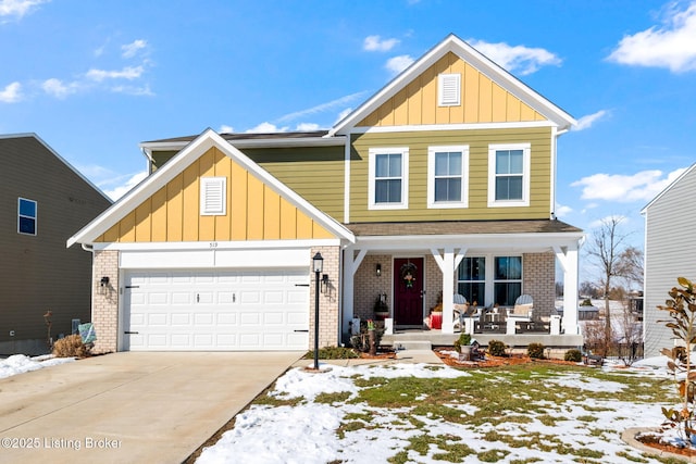 view of front of home with a porch, brick siding, driveway, and a garage