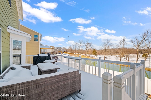 view of snow covered deck