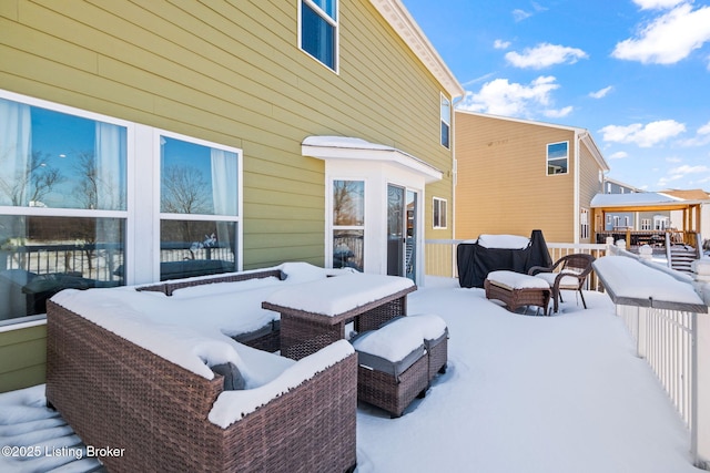 snow covered patio featuring a gazebo