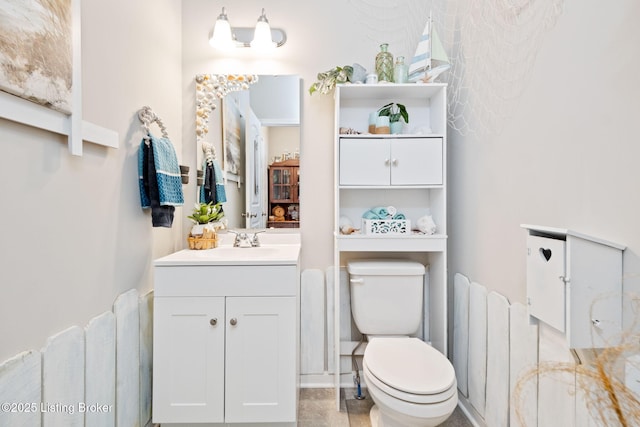 bathroom with vanity and toilet