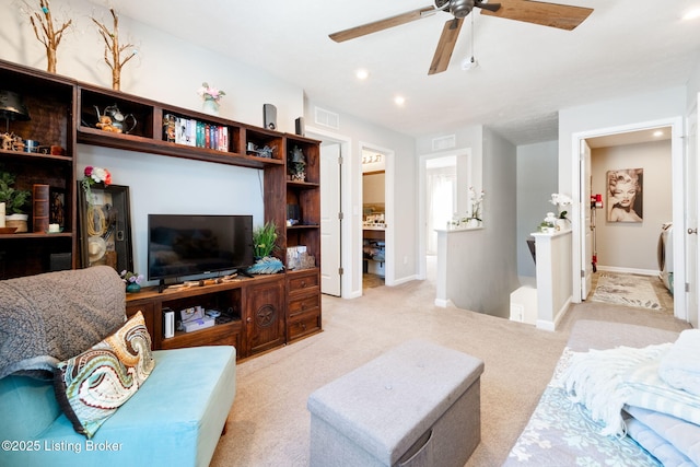 living room with recessed lighting, baseboards, visible vents, and light colored carpet