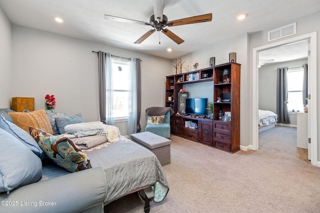 bedroom with recessed lighting, visible vents, a ceiling fan, and light colored carpet