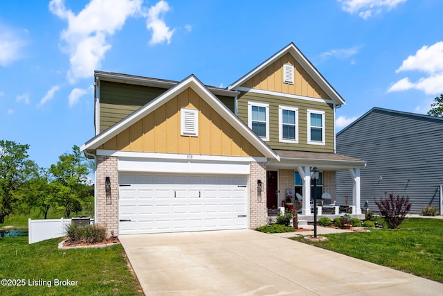 519 Williamsburg Dr, Mt Washington, KY 40047 - view of front facade featuring a front lawn, board and batten siding, covered porch, and brick siding