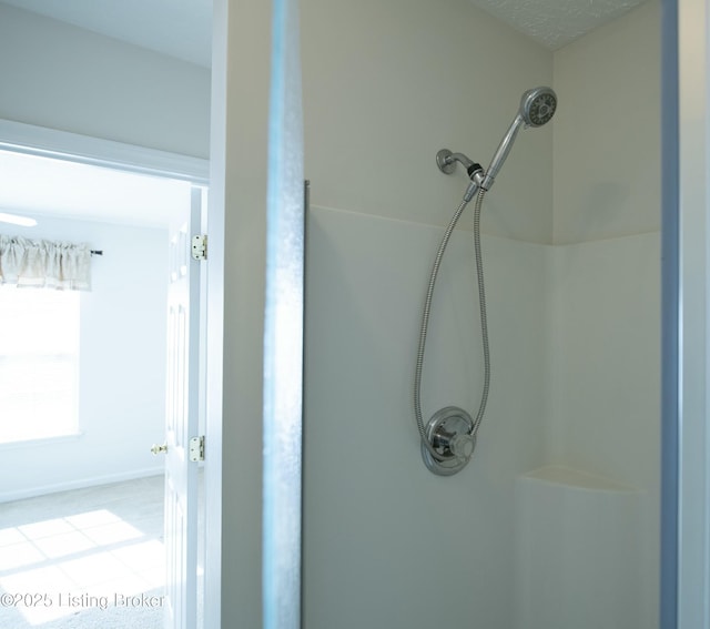 bathroom featuring walk in shower