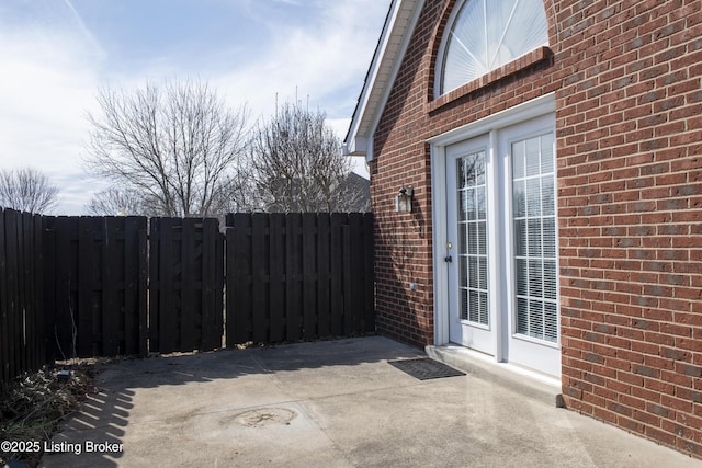 view of patio / terrace featuring fence