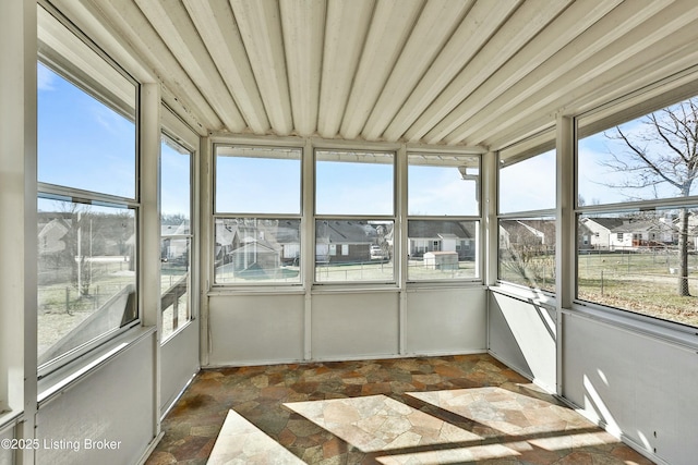 unfurnished sunroom featuring a healthy amount of sunlight