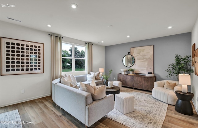 living area featuring recessed lighting, visible vents, baseboards, and wood finished floors