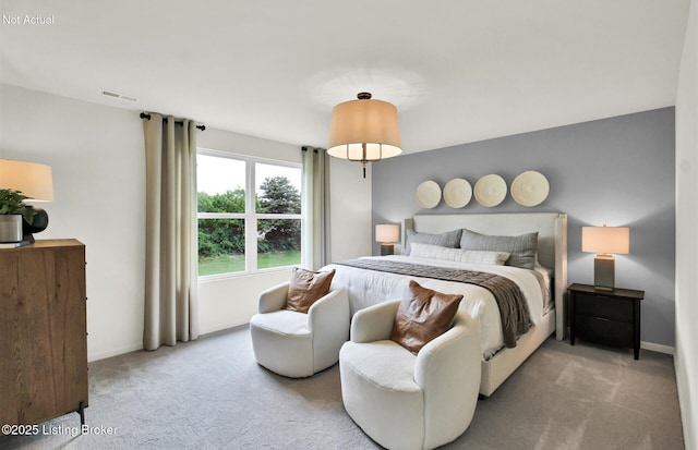 bedroom featuring baseboards, visible vents, and carpet flooring