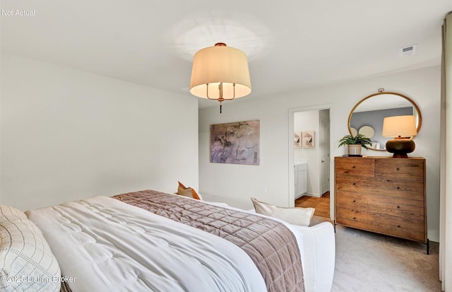 bedroom featuring light carpet and visible vents