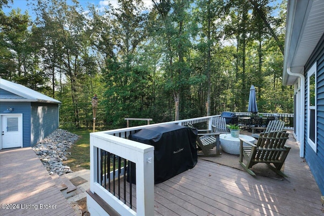 wooden terrace featuring outdoor dining area