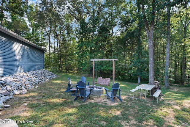 view of yard featuring an outdoor fire pit