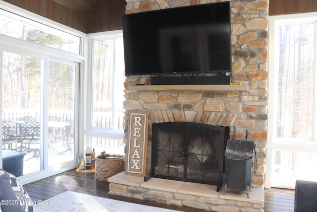 room details featuring a fireplace and wood finished floors