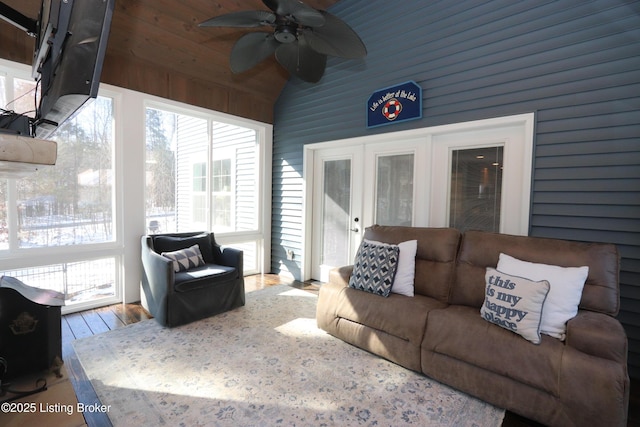 sunroom / solarium with lofted ceiling and a ceiling fan