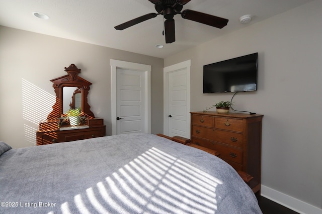 bedroom featuring ceiling fan and baseboards