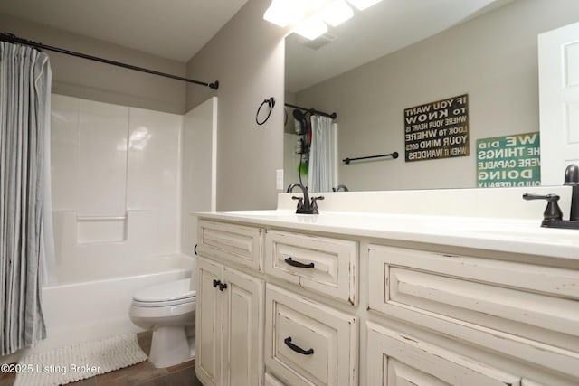 full bathroom with vanity, shower / bath combination with curtain, and toilet