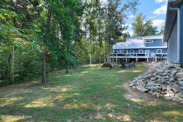 view of yard featuring a wooden deck