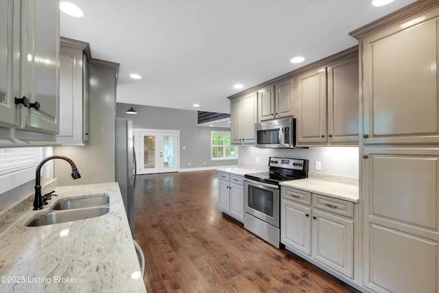 170 Moutardier Woods Way, Leitchfield, KY 42754 - kitchen with appliances with stainless steel finishes, a sink, dark wood-type flooring, light stone countertops, and recessed lighting
