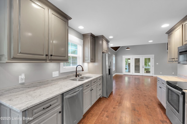 170 Moutardier Woods Way, Leitchfield, KY 42754 - kitchen featuring appliances with stainless steel finishes, a sink, french doors, wood finished floors, and recessed lighting