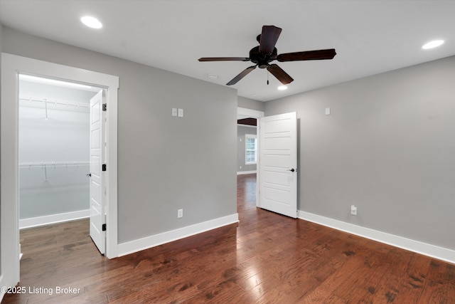 170 Moutardier Woods Way, Leitchfield, KY 42754 - unfurnished bedroom featuring baseboards, wood finished floors, a walk in closet, recessed lighting, and a ceiling fan