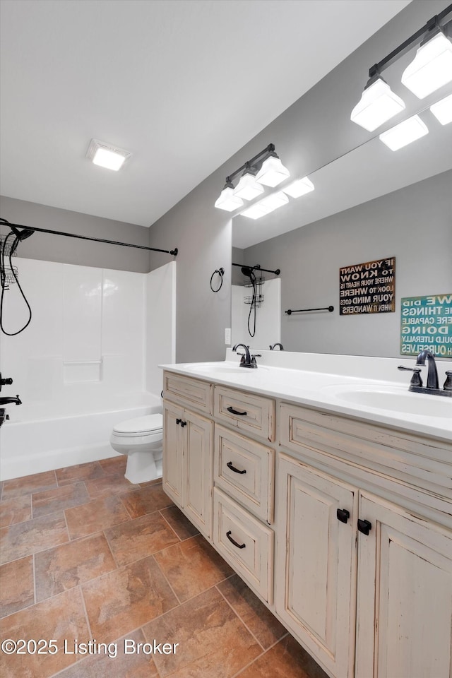 170 Moutardier Woods Way, Leitchfield, KY 42754 - bathroom featuring toilet, double vanity,  shower combination, and stone finish floors