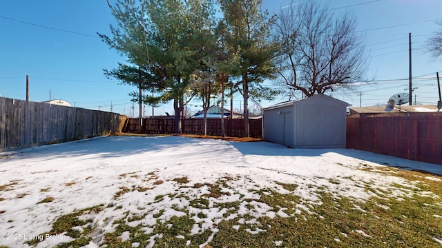 view of yard featuring an outbuilding, a shed, and a fenced backyard