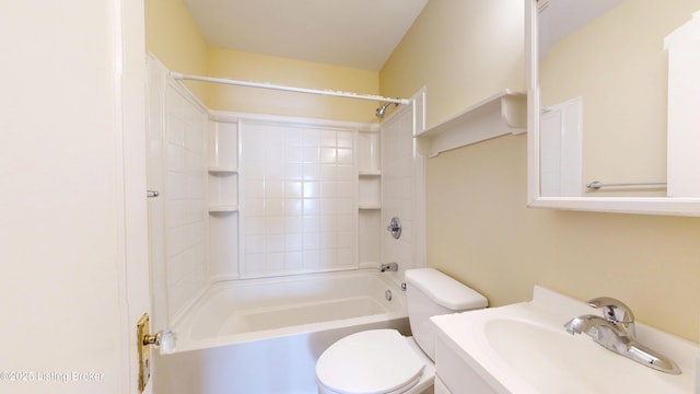 bathroom with toilet, shower / washtub combination, and vanity