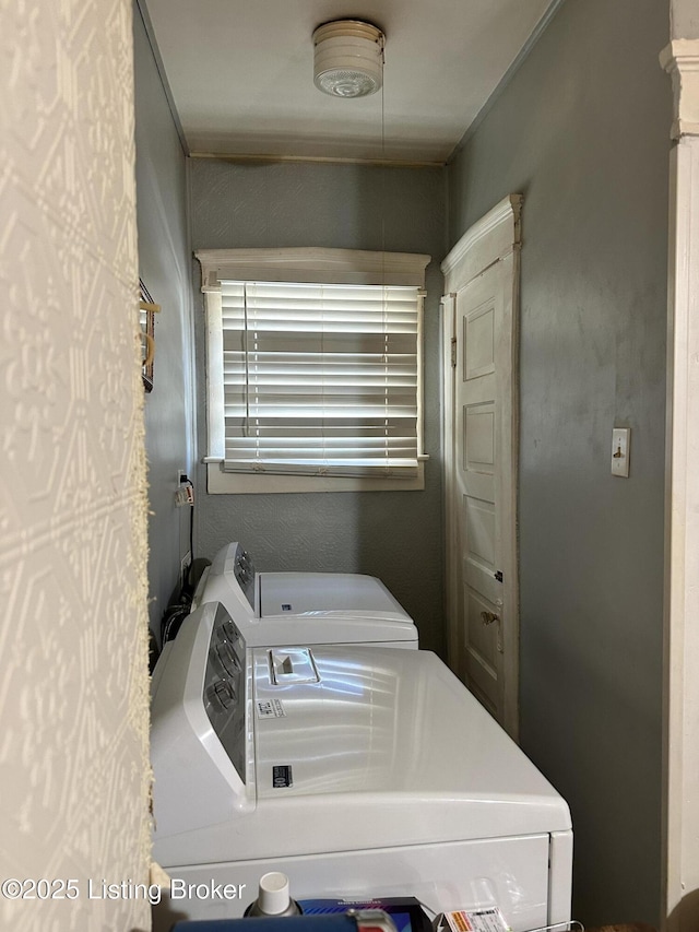 washroom with laundry area and washer and clothes dryer