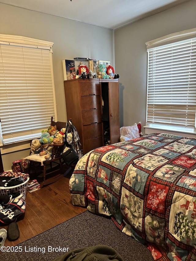 bedroom with wood finished floors