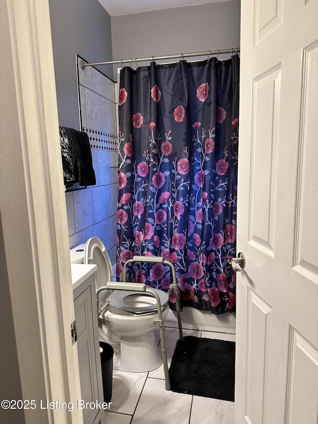 full bath featuring tile walls, a shower with shower curtain, vanity, and toilet