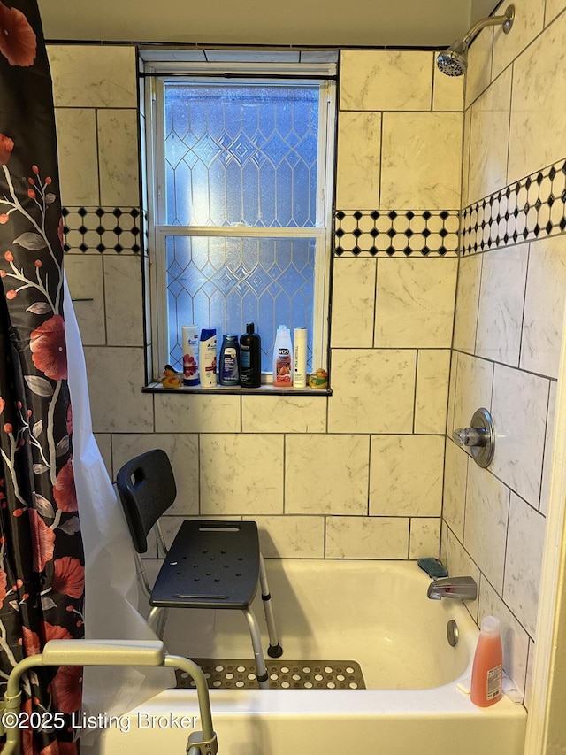 full bathroom featuring shower / bathtub combination with curtain