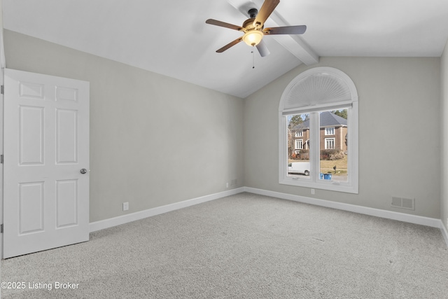 carpeted empty room with lofted ceiling with beams, baseboards, and visible vents