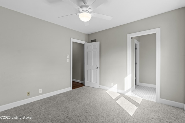 unfurnished bedroom featuring baseboards, visible vents, and carpet flooring