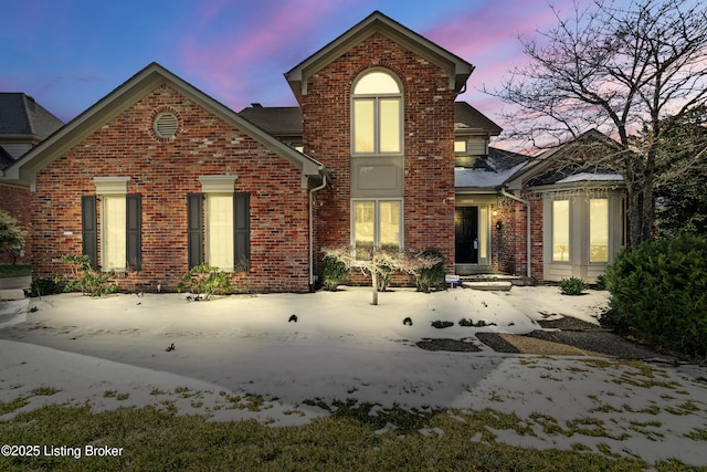 view of front of home with brick siding