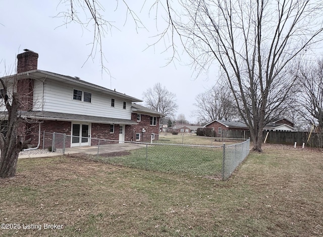 view of yard with a fenced backyard and a patio