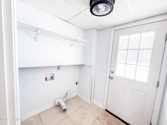 washroom featuring light tile patterned floors, laundry area, washer hookup, baseboards, and electric dryer hookup