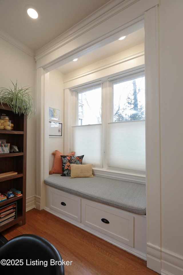 mudroom with light wood-type flooring, ornamental molding, and recessed lighting