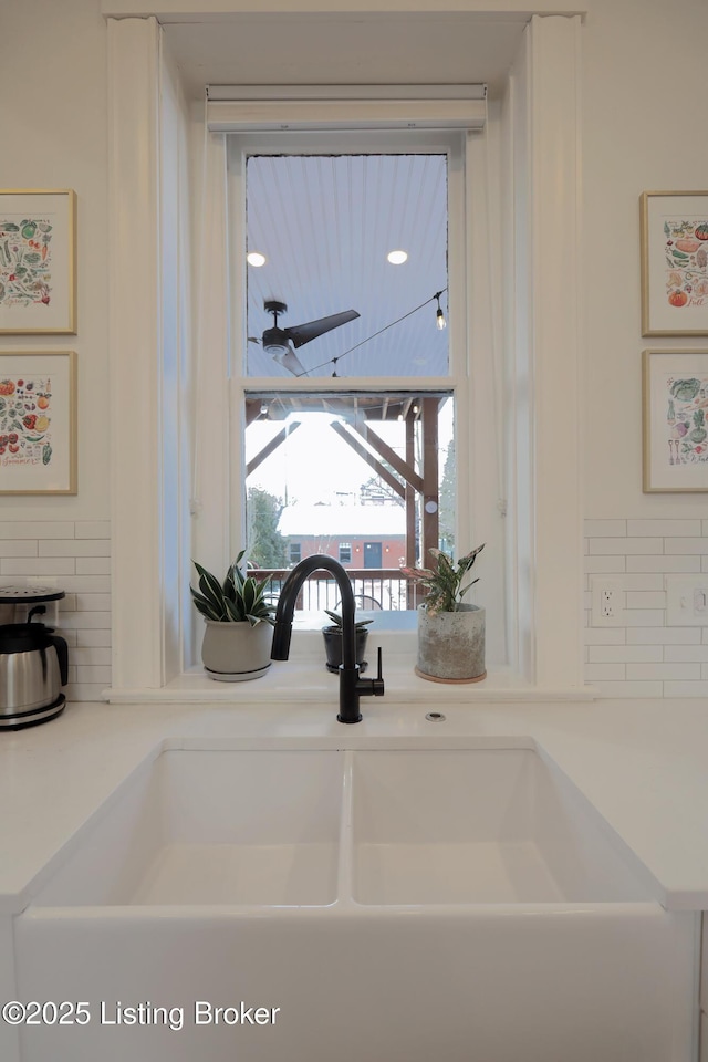 details featuring light countertops and a sink