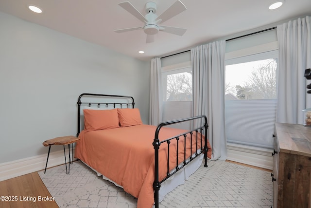 bedroom featuring light wood-type flooring, ceiling fan, baseboards, and recessed lighting