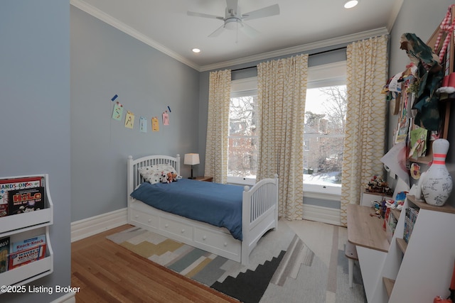 bedroom with recessed lighting, crown molding, light wood-style flooring, and baseboards