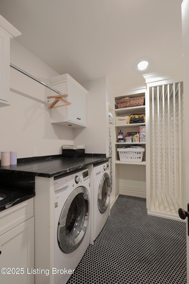 laundry room with cabinet space and separate washer and dryer