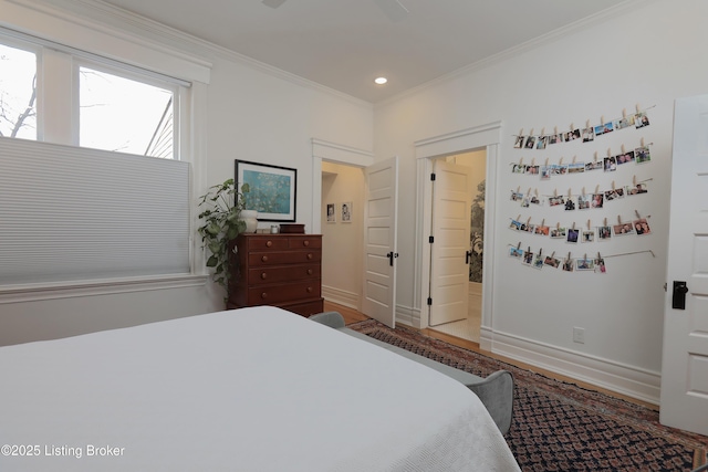 bedroom featuring recessed lighting, crown molding, baseboards, and wood finished floors