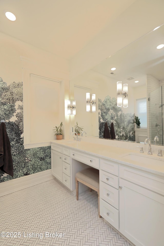 bathroom featuring a stall shower, recessed lighting, and vanity