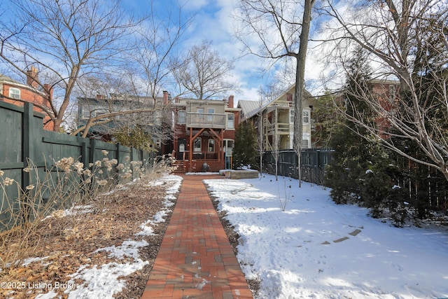 view of front facade featuring fence