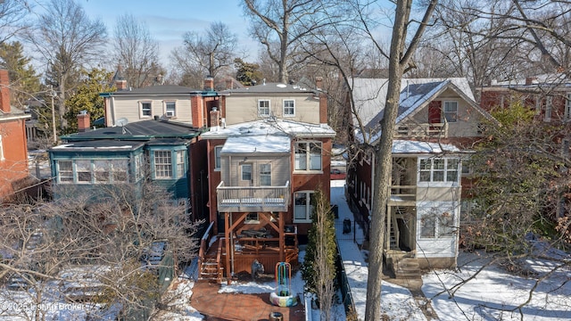 view of front of home featuring a residential view and a balcony