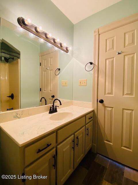 bathroom featuring vanity and wood finished floors