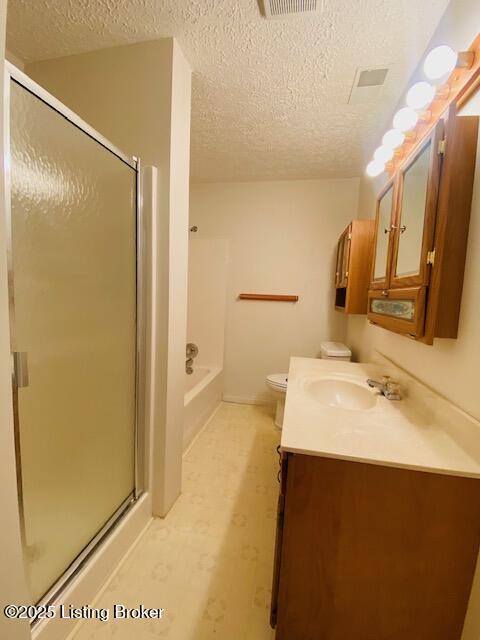 full bath with toilet, a garden tub, a textured ceiling, vanity, and a shower stall