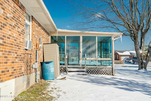 exterior space with brick siding and cooling unit